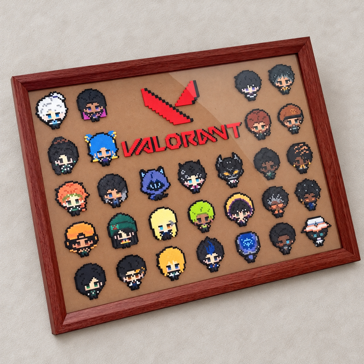 VALORANT full character bead display, With frame option, on an edited warm-gray suede background.