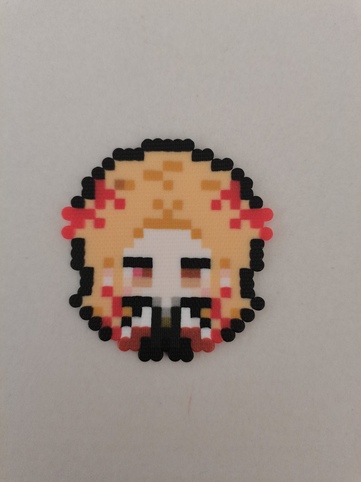 Kyojuro Rengoku (Flame) — actual handmade pixel bead character photograph.